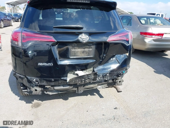 2018 Toyota RAV4 LE with VIN 2T3ZFREVXJW457751, listed as a IAAI auction lot 41529251 with 230,054 mi miles. Bid and sale history available at carsss.com. Image 6.