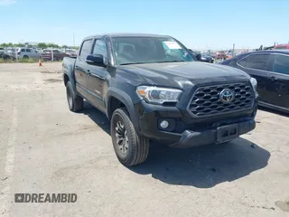 2023 Toyota Tacoma SR with VIN 3TMCZ5AN2PM601377, listed as a IAAI auction lot 42830017 with 82,663 mi miles and . Bid and sale history available at DreamBid. Image 1.