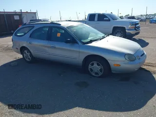 1996 Ford Taurus GL z VIN 1FALP57U9TG184497, wystawiony jako IAAI lot #42290105 z przebiegiem 149 155 mil mil oraz . Historia ofert i sprzedaży dostępna na DreamBid. Obrazek 1.