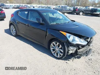2013 Hyundai Veloster w/Gray Int with VIN KMHTC6AD4DU131242, listed as a IAAI auction lot 42074517 with 76,713 mi miles and . Bid and sale history available at DreamBid. Image 1.