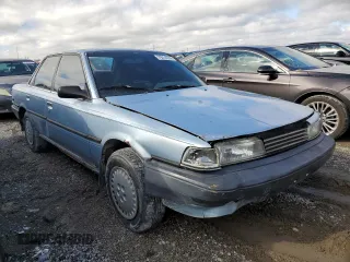 1990 Toyota Camry DLX z VIN 4T1SV21E8LU165609, wystawiony jako Copart lot #79314534 z przebiegiem 153 006 mil mil oraz Szkoda całkowita • Salvage title. Historia ofert i sprzedaży dostępna na DreamBid. Obrazek 4.