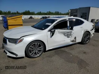 2019 Acura TLX Technology z VIN 19UUB2F40KA001858, wystawiony jako Copart lot #59313735 z przebiegiem 96 554 mil mil oraz Szkoda całkowita • Salvage title. Historia ofert i sprzedaży dostępna na DreamBid. Obrazek 1.