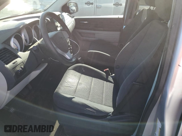 2009 Dodge Grand Caravan SE z VIN 1D8HN44E19B520096, wystawiony jako Copart lot #56339405 z przebiegiem 152 655 mil mil oraz Czysty tytuł • Clean title. Historia ofert i sprzedaży dostępna na DreamBid. Obrazek 7.