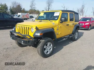 2019 Jeep Wrangler Unlimited Sport S with VIN 1C4HJXDG4KW579364, listed as a IAAI auction lot 41809318 with 22,370 mi miles and . Bid and sale history available at DreamBid. Image 2.