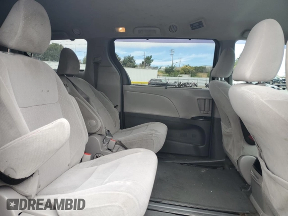 2015 Toyota Sienna LE AAS with VIN 5TDKK3DC1FS577795, listed as a Copart auction lot 66215355 with 197,902 mi miles and Salvage title. Bid and sale history available at DreamBid. Image 11.