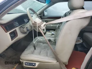 1995 Cadillac Concours z VIN 1G6KF52Y6SU244970, wystawiony jako Copart lot #75079524 z przebiegiem Nie podano mil oraz Szkody całkowita. Historia ofert i sprzedaży dostępna na DreamBid. Obrazek 7.