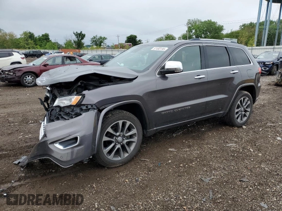 2017 Jeep Grand Cherokee Overland with VIN 1C4RJFCG8HC607872, listed as a Copart auction lot 57493195 with 164,478 mi miles and Salvage title. Bid and sale history available at DreamBid. Image 1.