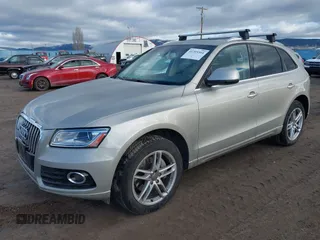 2014 Audi Q5 Premium Plus with VIN WA1CMAFP6EA063529, listed as a IAAI auction lot 41705364 with 154,501 mi miles and . Bid and sale history available at DreamBid. Image 2.