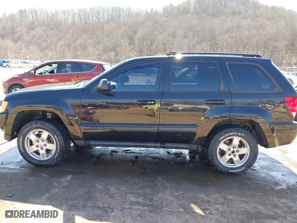 2007 Jeep Grand Cherokee Laredo with VIN 1J8GR48K67C523705, listed as a IAAI auction lot 41774281 with 215,572 mi miles. Bid and sale history available at carsss.com. Image 15.