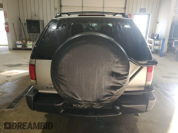 2004 Chevrolet Blazer LS z VIN 1GNCT18X34K143280, wystawiony jako Copart lot #50494785 z przebiegiem Nie podano mil oraz Szkoda całkowita • Salvage title. Historia ofert i sprzedaży dostępna na DreamBid. Obrazek 6.
