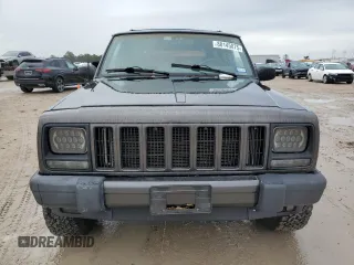 1999 Jeep Cherokee Sport with VIN 1J4FT68S2XL656679, listed as a Copart auction lot 88145875 with 254,038 mi miles and Salvage title. Bid and sale history available at DreamBid. Image 5.