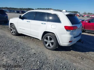 2014 Jeep Grand Cherokee Overland with VIN 1C4RJFCG9EC587322, listed as a IAAI auction lot 41632299 with 161,779 mi miles. Bid and sale history available at carsss.com. Image 3.