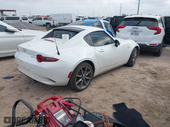 2021 Mazda MX-5 Miata Grand Touring with VIN JM1NDAM71M0454514, listed as a IAAI auction lot 41940252 with Not provided miles and . Bid and sale history available at DreamBid. Image 4.