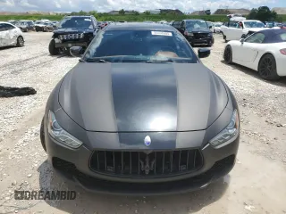 2017 Maserati Ghibli z VIN ZAM57XSL0H1203506, wystawiony jako Copart lot #56698805 z przebiegiem 67 714 mil mil oraz Tytuł czysty. Historia ofert i sprzedaży dostępna na DreamBid. Obrazek 5.