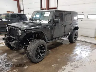 2015 Jeep Wrangler Unlimited Sahara with VIN 1C4BJWEG6FL688382, listed as a IAAI auction lot 41620621 with 138,119 mi miles. Bid and sale history available at carsss.com. Image 2.