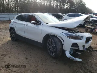 2022 BMW X2 sDrive28i with VIN WBXYH9C05N5T67775, listed as a Copart auction lot 44045505 with 34,100 mi miles and Salvage Title. Bid and sale history available at carsss.com. Image 4.