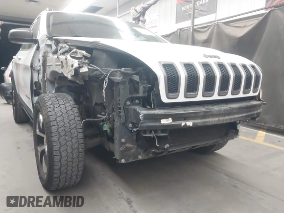 2015 Jeep Cherokee Trailhawk with VIN 1C4PJMBS1FW665500, listed as a IAAI auction lot 42068268 with 127,246 mi miles. Bid and sale history available at carsss.com. Image 6.