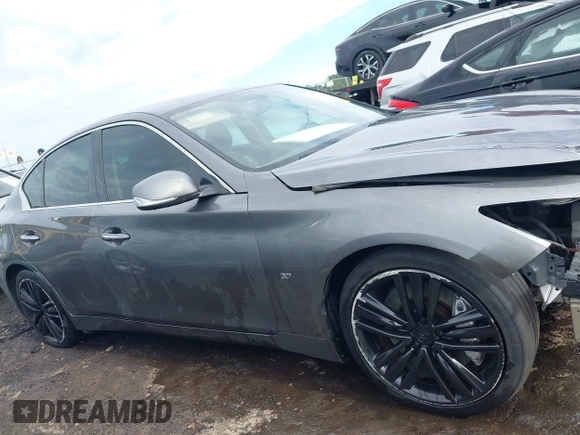 2014 Infiniti Q50 Premium with VIN JN1BV7AP8EM693109, listed as a IAAI auction lot 42183699 with 171,981 mi miles and . Bid and sale history available at DreamBid. Image 14.