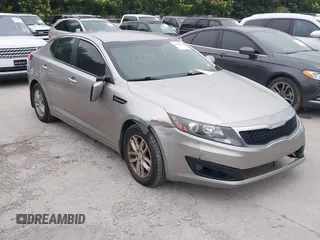 2012 Kia Optima LX z VIN KNAGM4A79C5277787, wystawiony jako IAAI lot #42365591 z przebiegiem 132 072 mil mil oraz . Historia ofert i sprzedaży dostępna na DreamBid. Obrazek 1.