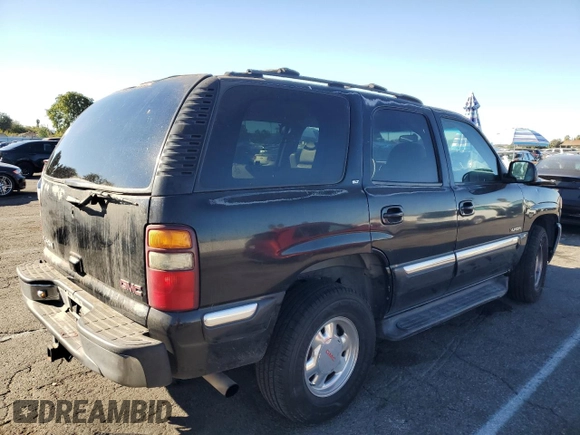 2001 GMC Yukon SLT z VIN 1GKEC13T41J148550, wystawiony jako Copart lot #80580964 z przebiegiem Nie podano mil oraz Szkoda całkowita • Salvage title. Historia ofert i sprzedaży dostępna na DreamBid. Obrazek 3.