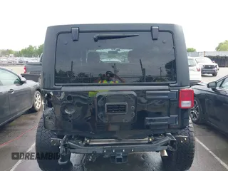 2015 Jeep Wrangler Unlimited Willys Wheeler with VIN 1C4BJWDG4FL687829, listed as a IAAI auction lot 42099147 with 98,969 mi miles and . Bid and sale history available at DreamBid. Image 6.