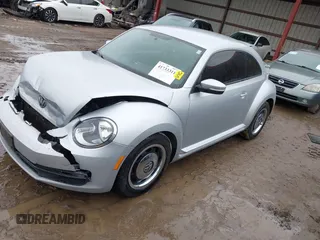 2012 Volkswagen Beetle 2.5L PZEV with VIN 3VWJP7ATXCM601206, listed as a IAAI auction lot 41733311 with 111,742 mi miles. Bid and sale history available at carsss.com. Image 2.