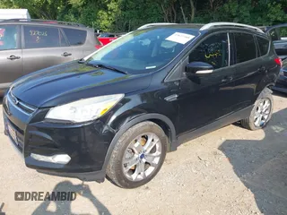 2014 Ford Escape Titanium with VIN 1FMCU9J93EUD60149, listed as a IAAI auction lot 39837388 with 154,880 mi miles. Bid and sale history available at carsss.com. Image 2.