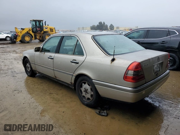 1997 Mercedes-Benz C with VIN WDBHA28E3VF530316, listed as a Copart auction lot 85938384 with 169,664 mi miles and Salvage Title. Bid and sale history available at carsss.com. Image 2.