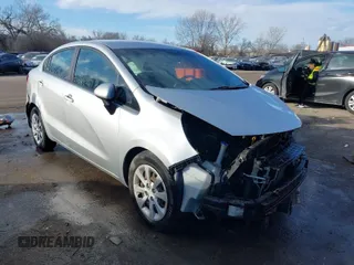 2015 Kia Rio LX with VIN KNADM4A35F6484823, listed as a IAAI auction lot 41597941 with 135,553 mi miles. Bid and sale history available at carsss.com. Image 1.