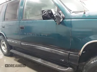 1996 Chevrolet Tahoe z VIN 1GNEK13R4TJ417000, wystawiony jako IAAI lot #41992121 z przebiegiem 166 215 mil mil oraz . Historia ofert i sprzedaży dostępna na DreamBid. Obrazek 6.