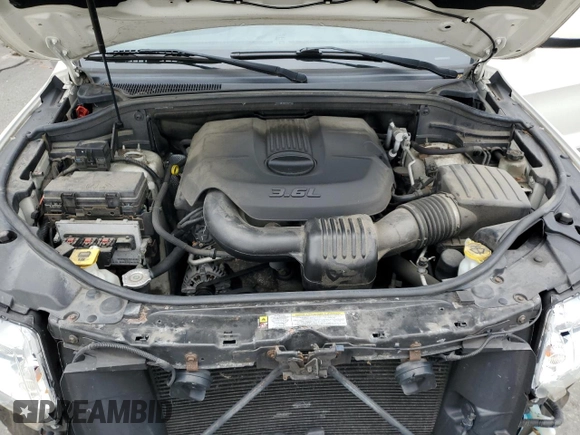 2011 Jeep Grand Cherokee Laredo with VIN 1J4RR4GG9BC515467, listed as a Copart auction lot 58411085 with 112,558 mi miles and Salvage title. Bid and sale history available at DreamBid. Image 12.