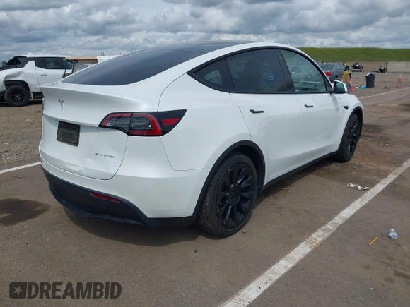 2022 Tesla Model Y Long Range with VIN 7SAYGDEE2NF403354, listed as a IAAI auction lot 41986216 with 53,177 mi miles and . Bid and sale history available at DreamBid. Image 4.