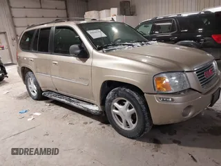 2006 GMC Envoy SLE with VIN 1GKDT13S062160490, listed as a IAAI auction lot 41610149 with 1 mi miles. Bid and sale history available at carsss.com. Image 1.
