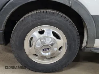 2022 Ford Transit Cargo z VIN 1FTBR2YG8NKA06555, wystawiony jako IAAI lot #42359491 z przebiegiem 68 954 mil mil oraz . Historia ofert i sprzedaży dostępna na DreamBid. Obrazek 1.