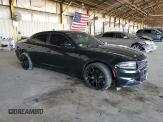 2015 Dodge Charger SXT with VIN 2C3CDXJG9FH748809, listed as a Copart auction lot 61682335 with 128,252 mi miles and Salvage title. Bid and sale history available at DreamBid. Image 4.