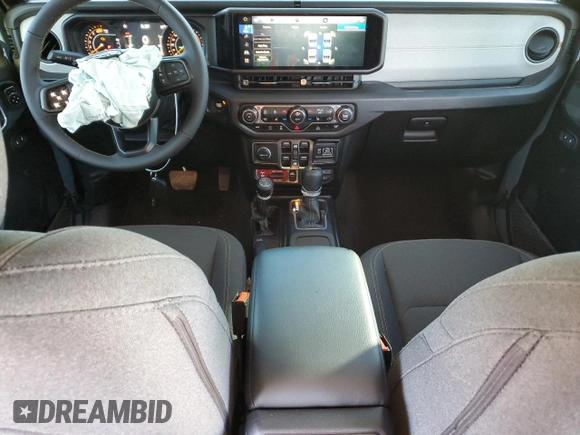 2024 Jeep Wrangler Sport S with VIN 1C4PJXDG2RW346671, listed as a Copart auction lot 57966375 with 9,430 mi miles and Salvage title. Bid and sale history available at DreamBid. Image 8.
