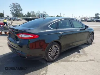 2015 Ford Fusion Titanium with VIN 3FA6P0K91FR168665, listed as a IAAI auction lot 41852403 with 138,711 mi miles. Bid and sale history available at carsss.com. Image 4.