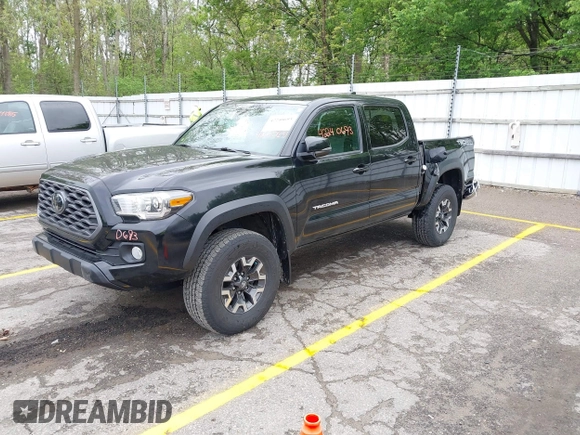 2021 Toyota Tacoma SR with VIN 3TMCZ5AN0MM417261, listed as a IAAI auction lot 42240693 with 38,625 mi miles and . Bid and sale history available at DreamBid. Image 2.