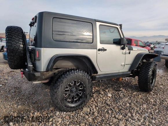 2007 Jeep Wrangler Rubicon z VIN 1J8GA64157L125319, wystawiony jako Copart lot #82929184 z przebiegiem 82 019 mil mil oraz Szkoda całkowita • Salvage title. Historia ofert i sprzedaży dostępna na DreamBid. Obrazek 3.