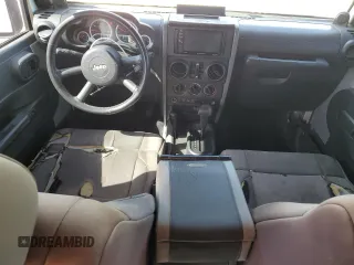 2010 Jeep Wrangler Unlimited Rubicon with VIN 1J4BA6H12AL107485, listed as a Copart auction lot 48802825 with 123,299 mi miles and Salvage title. Bid and sale history available at DreamBid. Image 8.