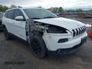 2015 Jeep Cherokee Latitude z VIN 1C4PJMCB0FW744235, wystawiony jako IAAI lot #42204117 z przebiegiem 103 694 mil mil oraz . Historia ofert i sprzedaży dostępna na DreamBid. Obrazek 1.