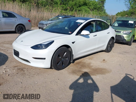2023 Tesla Model 3 with VIN 5YJ3E1EA3PF617460, listed as a IAAI auction lot 42154401 with 9,578 mi miles and . Bid and sale history available at DreamBid. Image 2.