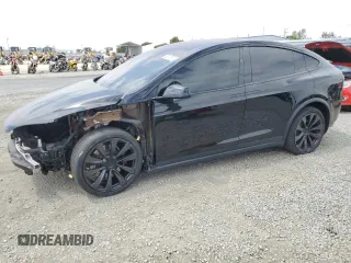 2022 Tesla Model X with VIN 7SAXCDE59NF360610, listed as a Copart auction lot 52575365 with 51,557 mi miles and Salvage Title. Bid and sale history available at carsss.com. Image 1.