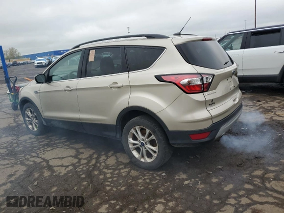 2017 Ford Escape SE z VIN 1FMCU0GDXHUB90657, wystawiony jako Copart lot #55655055 z przebiegiem 229 960 mil mil oraz Czysty tytuł • Clean title. Historia ofert i sprzedaży dostępna na DreamBid. Obrazek 2.