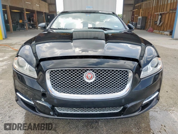 2014 Jaguar XJ Portfolio with VIN SAJWA2GZ2E8V64993, listed as a Copart auction lot 88774965 with 78,689 mi miles and Salvage title. Bid and sale history available at DreamBid. Image 5.