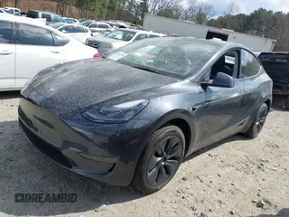 2025 Tesla Model Y Long Range with VIN 7SAYGDED3SA352138, listed as a IAAI auction lot 41760798 with 1,209 mi miles and . Bid and sale history available at DreamBid. Image 22.