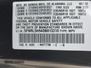 2013 Honda Odyssey Touring with VIN 5FNRL5H94DB013310, listed as a IAAI auction lot 42079565 with 128,622 mi miles and . Bid and sale history available at carsss.com. Image 9.