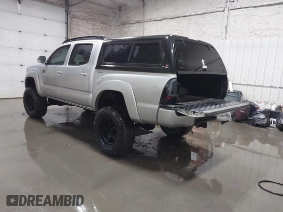 2011 Toyota Tacoma with VIN 3TMLU4EN9BM070836, listed as a IAAI auction lot 41668595 with 89,879 mi miles and . Bid and sale history available at DreamBid. Image 3.