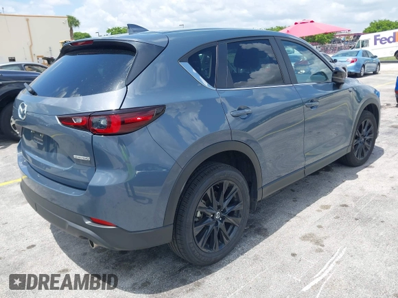 2024 Mazda CX-5 S Carbon Edition z VIN JM3KFBCLXR0521353, wystawiony jako IAAI lot #42351444 z przebiegiem 17 270 mil mil oraz . Historia ofert i sprzedaży dostępna na DreamBid. Obrazek 4.