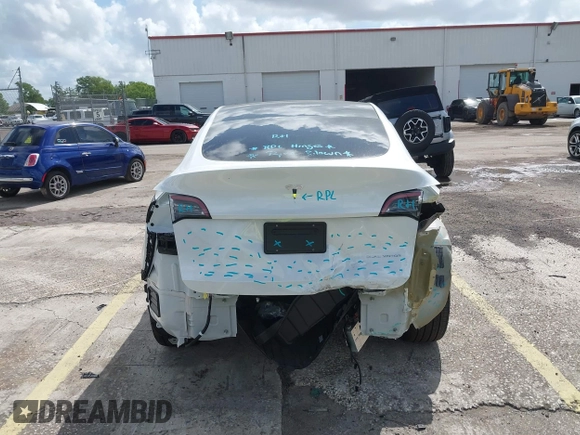 2025 Tesla Model Y Long Range with VIN 7SAYGDEE2SA337378, listed as a IAAI auction lot 41940840 with 1,676 mi miles and . Bid and sale history available at DreamBid. Image 16.